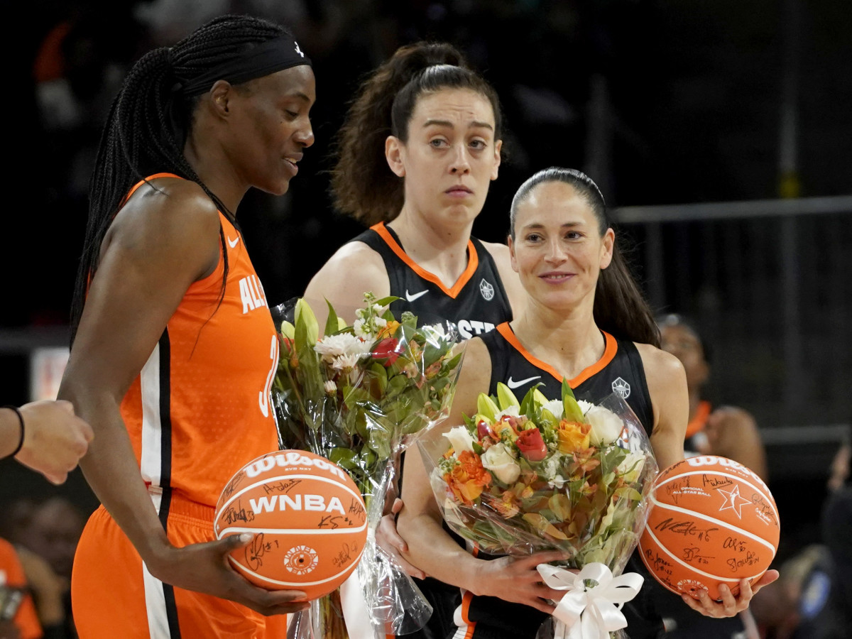 Sue Bird Sylvia Fowles are presented with flowers during the first half in a WNBA All Star Game.